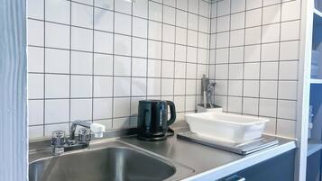Fridge, microwave, stovetop, cookware/dishes/utensils