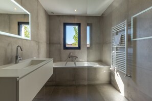 Bathtub, hair dryer, towels