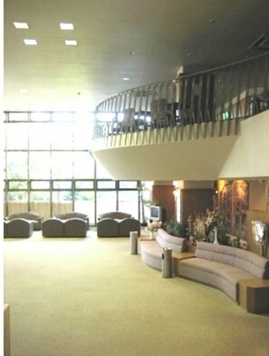 Relax in the spacious lobby with a comfortable seating area and outdoor views from the balcony.