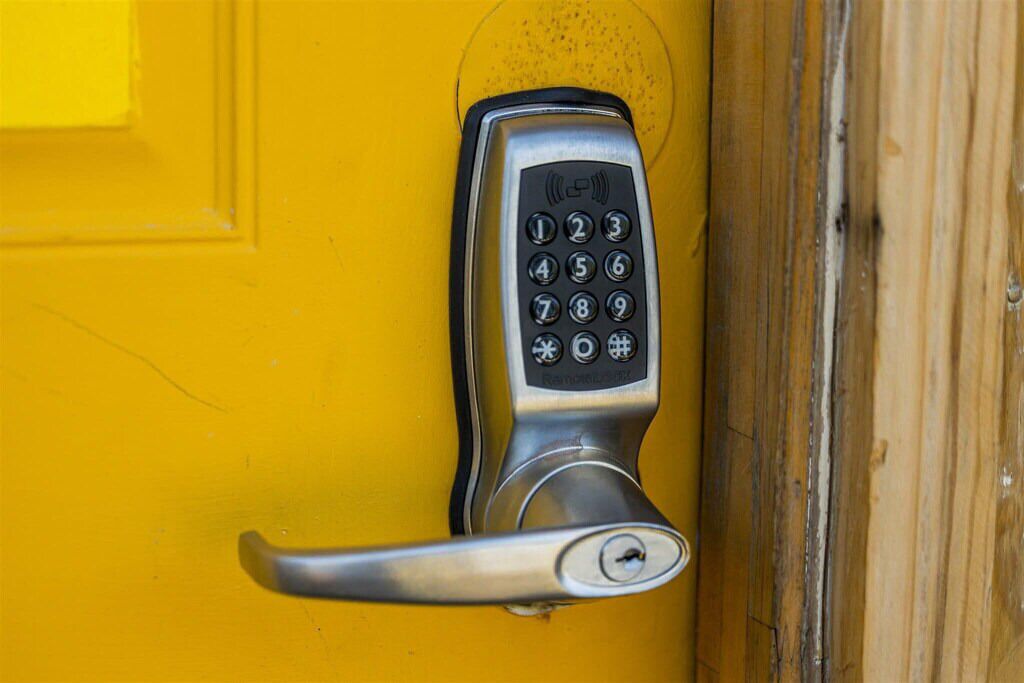 A door with a numeric keypad lock.