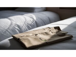 Experience comfort in this serene retreat with a neatly made bed and a focus on functionality.