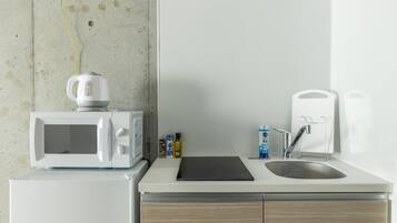 Fridge, microwave, electric kettle, cookware/dishes/utensils