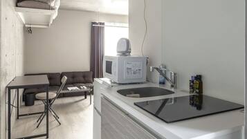 Fridge, microwave, electric kettle, cookware/dishes/utensils