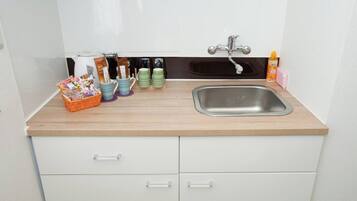 Fridge, microwave, stovetop, cookware/dishes/utensils