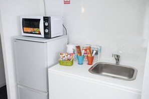 Fridge, microwave, stovetop, cookware/dishes/utensils