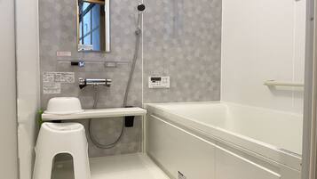 Bathtub, hair dryer, towels, soap