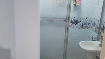 Shower, hair dryer, towels, toilet paper