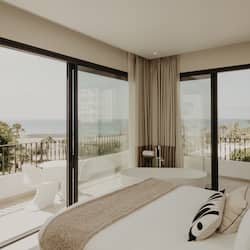 Deluxe Studio, Terrace, Sea View | Minibar, in-room safe, individually decorated, desk