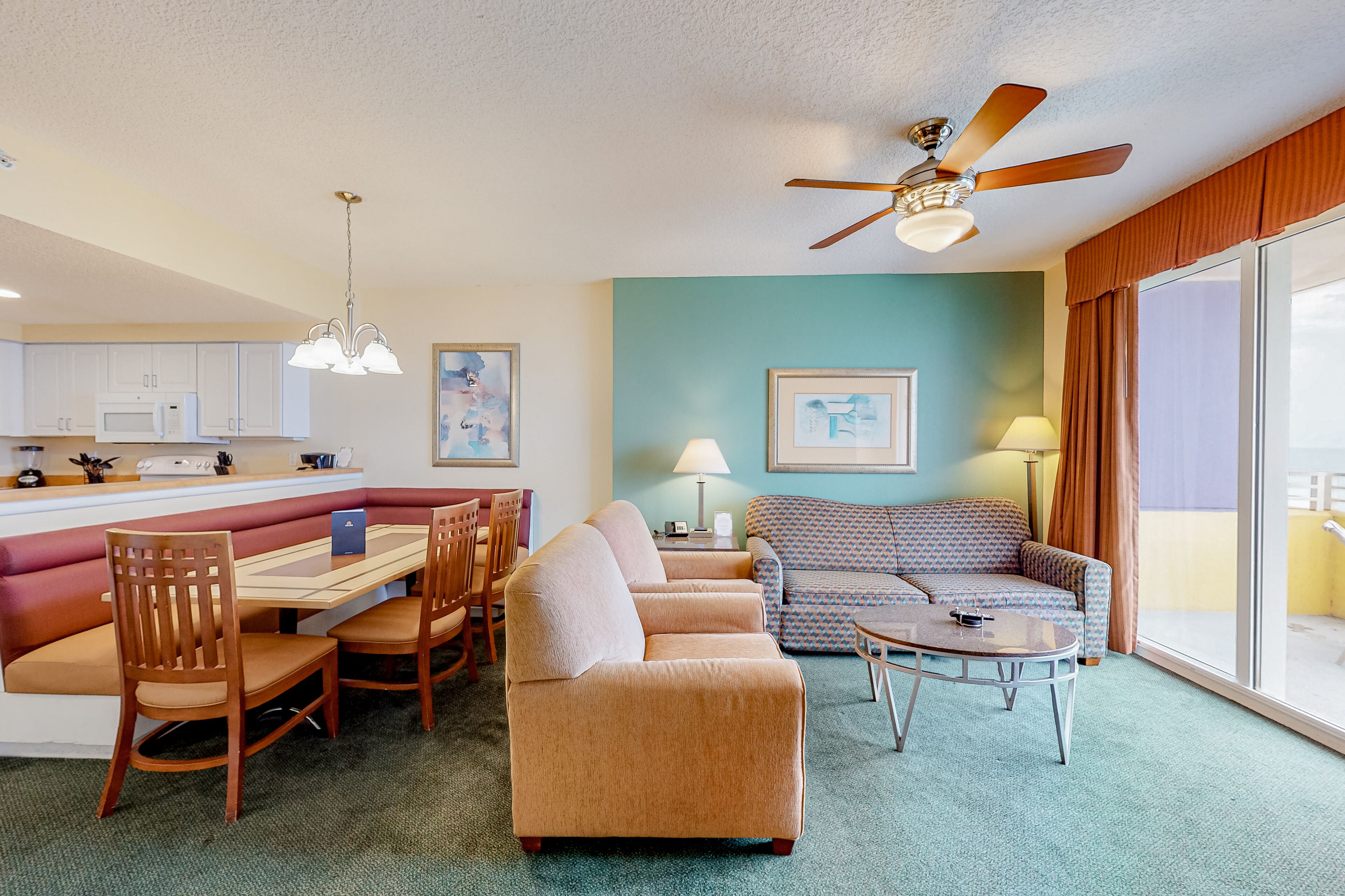 Colorful beachfront condo with ocean views, balcony, pools & gym