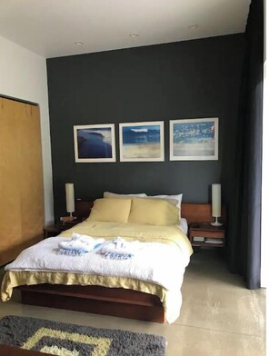 Relax in comfort with a large bed, bedside tables, and a calming atmosphere.