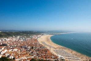 Enjoy a panoramic view of the beach and sea from this hillside town.