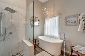 Bathtub, hair dryer, towels, soap