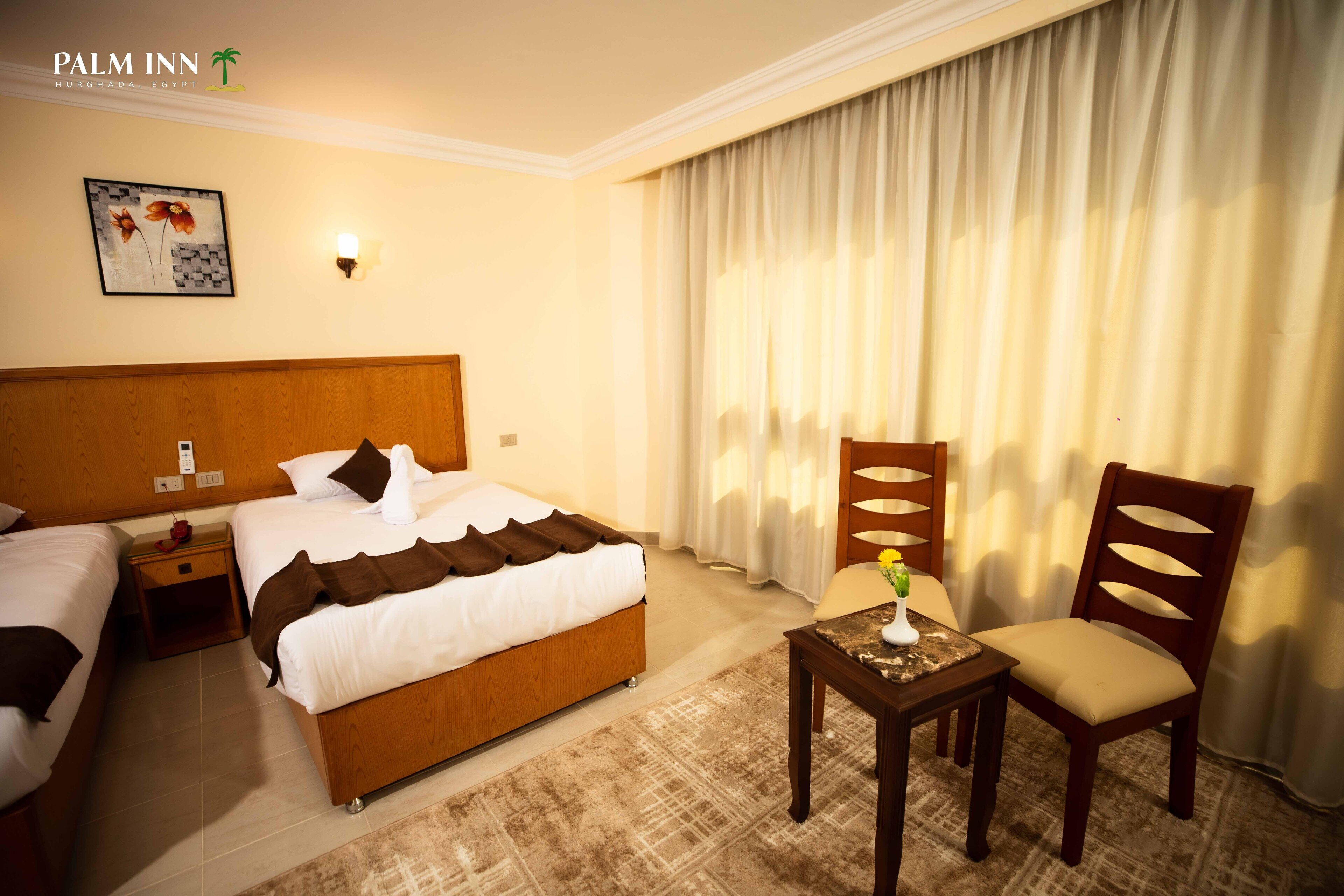 Foto - Palm Inn Suites Hotel