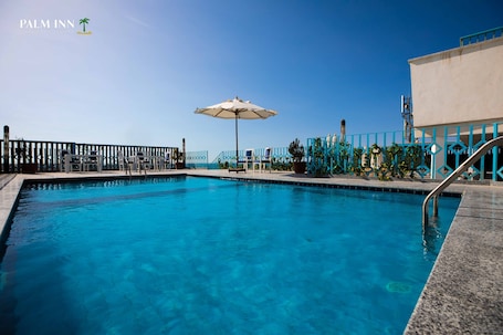 Indoor pool, open 7:00 AM to 5:00 PM, pool umbrellas