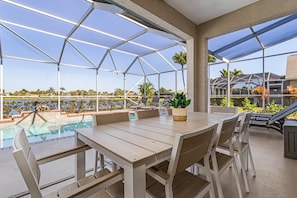 Outdoor dining - Beautiful 5 Bedroom Pool Home on the Water! (Fort Myers)