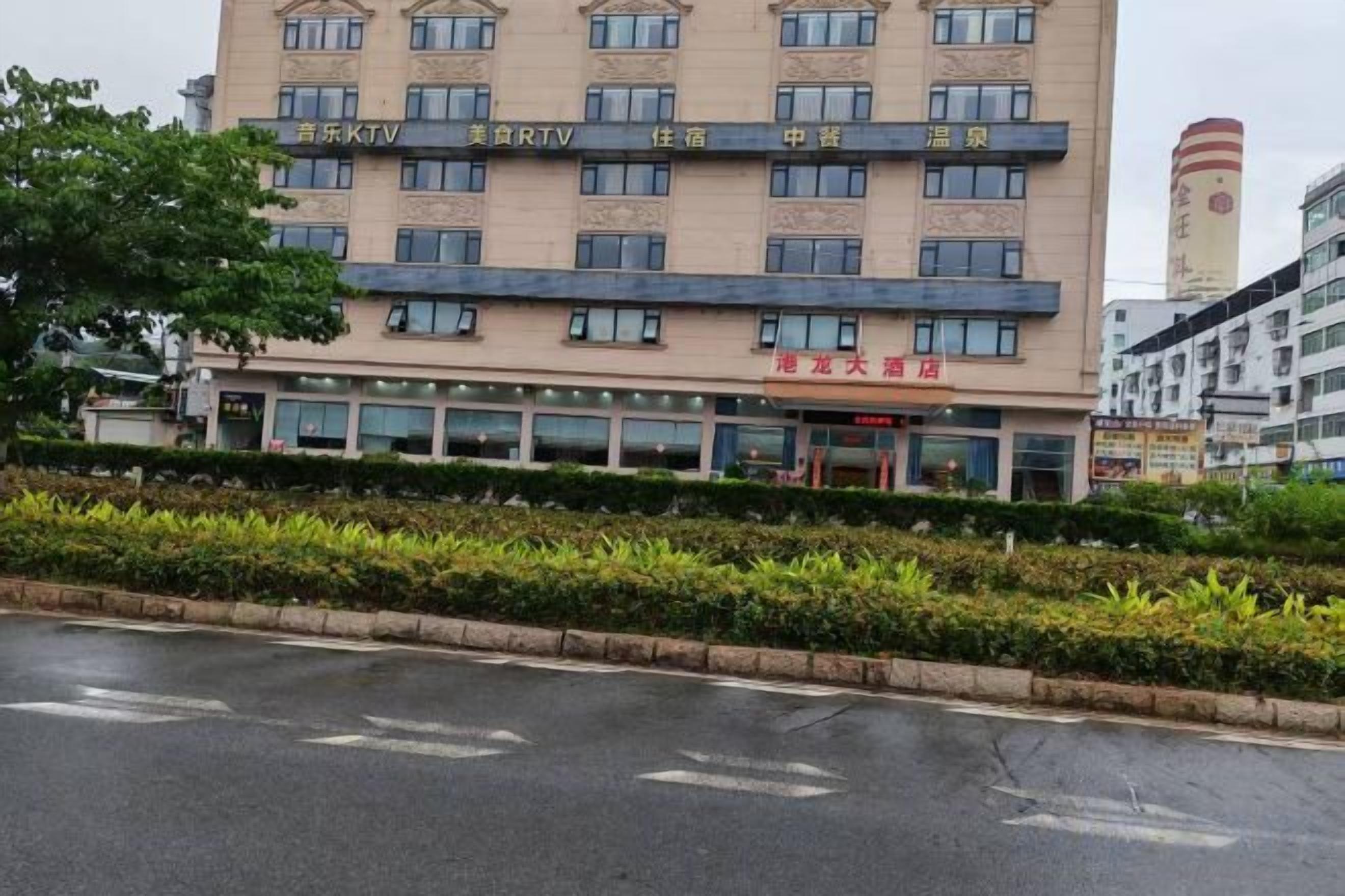 A multi-story hotel with a flat facade, multiple windows, and a visible entrance.