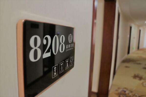 A digital display with the number 8208, likely indicating a room number or hotel room identifier. - Jiaxi Hotel (Tongliao)
