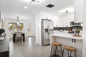 Enjoy cooking and dining in this well-equipped kitchen with a dining area and bar.