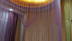 A chandelier with multiple hanging strands. - Pingxiang IKEA Hotel Apartment (Pingxiang)
