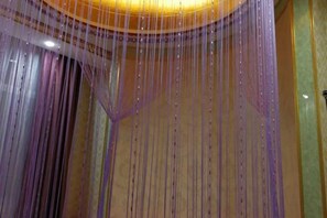 A chandelier with multiple hanging strands.