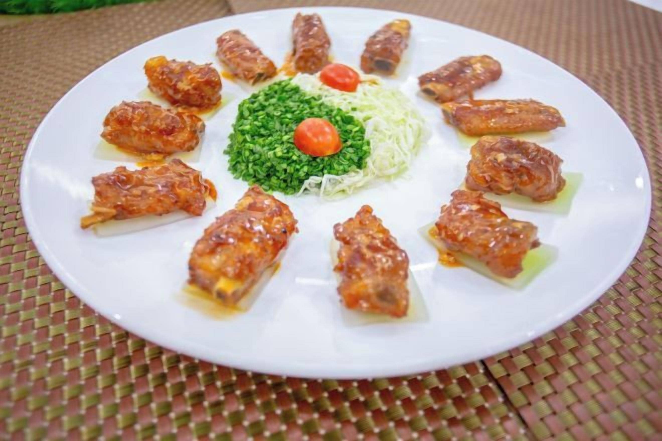 A plate with food items arranged in a circular pattern.