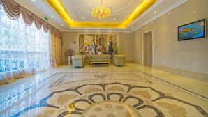 A spacious lobby with a large chandelier, a reception desk, and a patterned floor. - Vienna 3 Best Hotel Guangdong Luoding Luocheng (Yunfu)