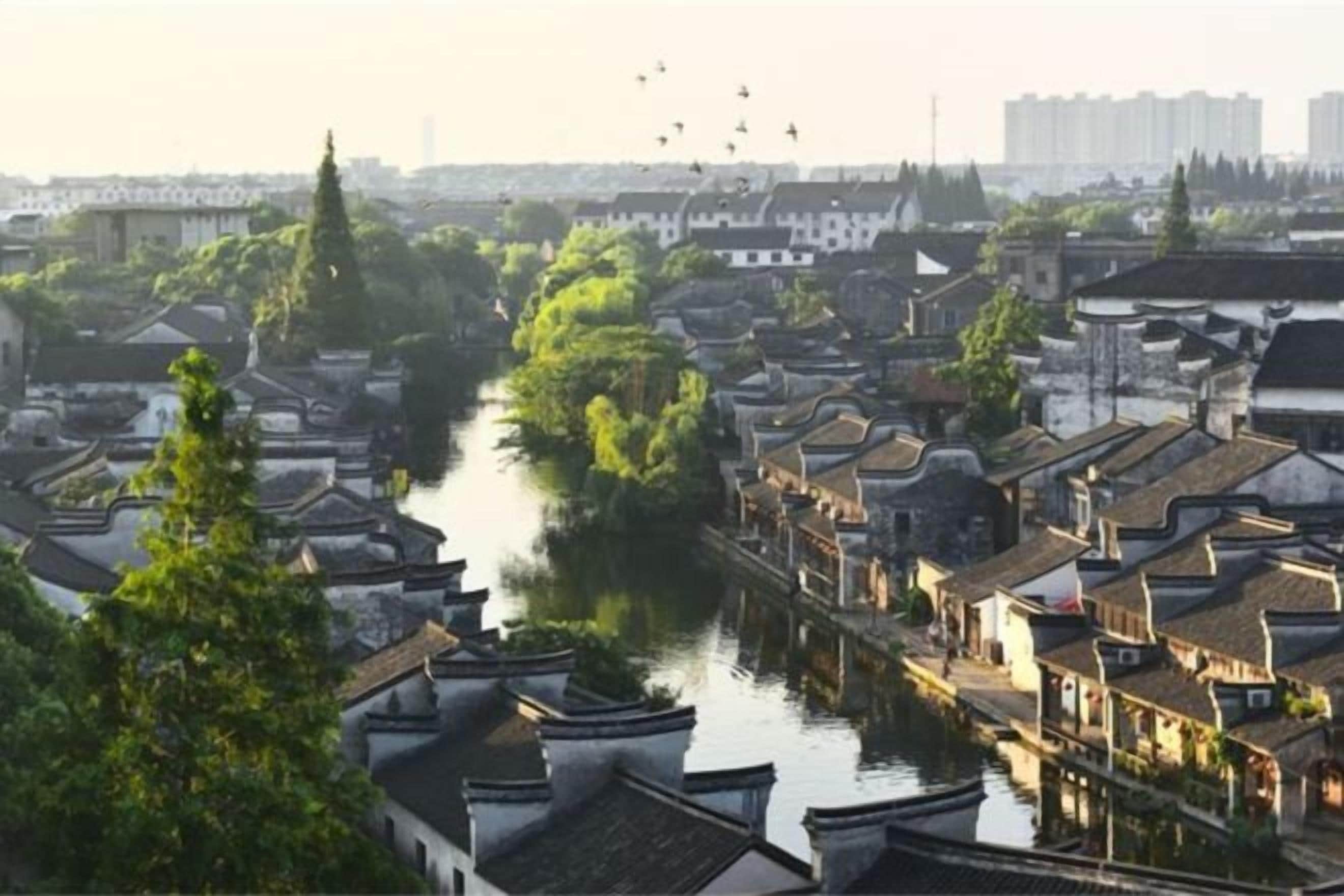 A traditional riverside town with narrow streets and historic buildings.