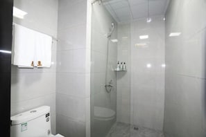 A small, enclosed shower area with a toilet and a mirror. - Super 8 Hotel (Hefei Ma'anshan Road Hegongda South Subway Station) (Hefei)