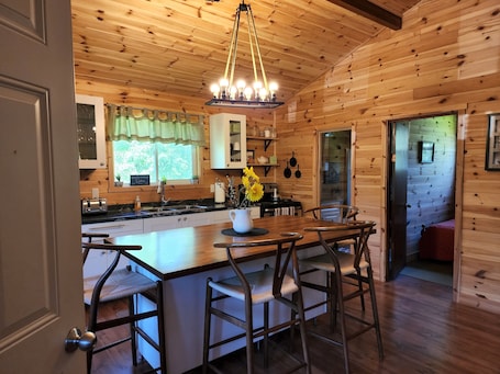 Dining. The cozy cabin… 12 minutes to Grand Beach!