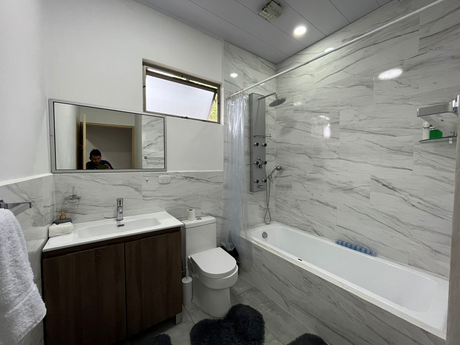 Combined shower/tub, hair dryer, towels, soap