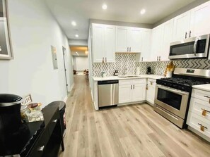 Fridge, microwave, oven, stovetop - Boho Chic 2BR Condo, Queen Bed With Free Parking (Chicago)