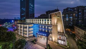 A modern hotel with a distinctive angular design, multiple floors, and a prominent entrance. - Jiasheng Jinling Hotel (Nanjing)