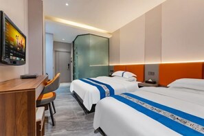 A hotel room with two beds, a desk, and a TV. - Yali Siji Business Hostel (Shenzhen)