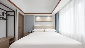 A hotel room with a bed, a nightstand, a wall-mounted shelf, and a window with curtains. - BONUS HOTEL (Shenzhen)