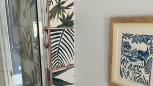 A corner of a room with a glass partition, a framed artwork, and a potted plant. - Field Maple -free parking -Grade Ii listed- first (Huntingdon)