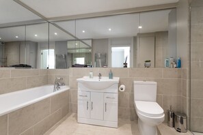 Combined shower/bathtub, hair dryer, towels, soap