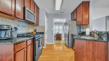 Fridge, coffee/tea maker, cookware/dishes/utensils