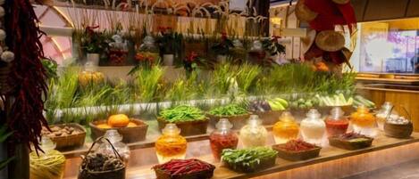 A display of various food items and plants in a well-lit, indoor setting.