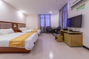A hotel room with two beds, a desk, a chair, a television, and an air conditioning unit. - Tingtaoju Hotel (Taishan)