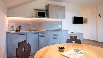 Fridge, microwave, stovetop, coffee/tea maker