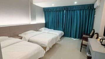 Desk, blackout drapes, bed sheets