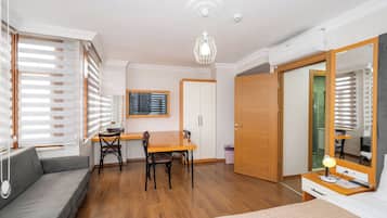 Deluxe Quadruple Room | In-room safe, desk, laptop workspace, soundproofing