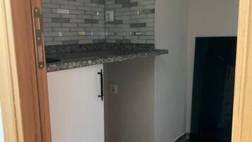 Family Suite, 2 Queen Beds | Private kitchen | Mini-fridge