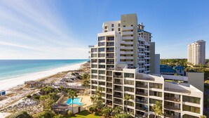 A multi-story hotel with balconies, a pool, and a beach view. - CostaVista-Sandestin: Steps to Beach/Gulf Views! (Miramar Beach)