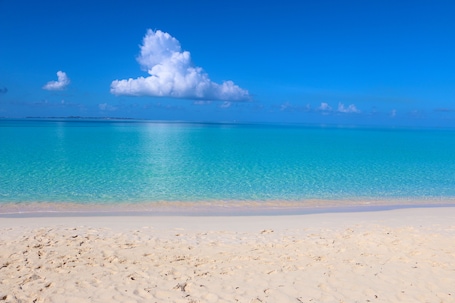 On the beach, white sand. Rendezvous Bay Hotel