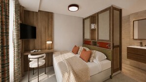A hotel room with a bed, a desk, a chair, a TV, a mirror, and a bathroom.