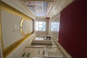 A narrow, narrow hallway with a red wall, a white door, and a ceiling with a colorful mural. - Vienna Hotel (Jieyang Longwei) (Jieyang)