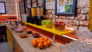A breakfast bar with various food items, including fruits, cereals, and condiments. - S42 Hotel Prague (Prague)