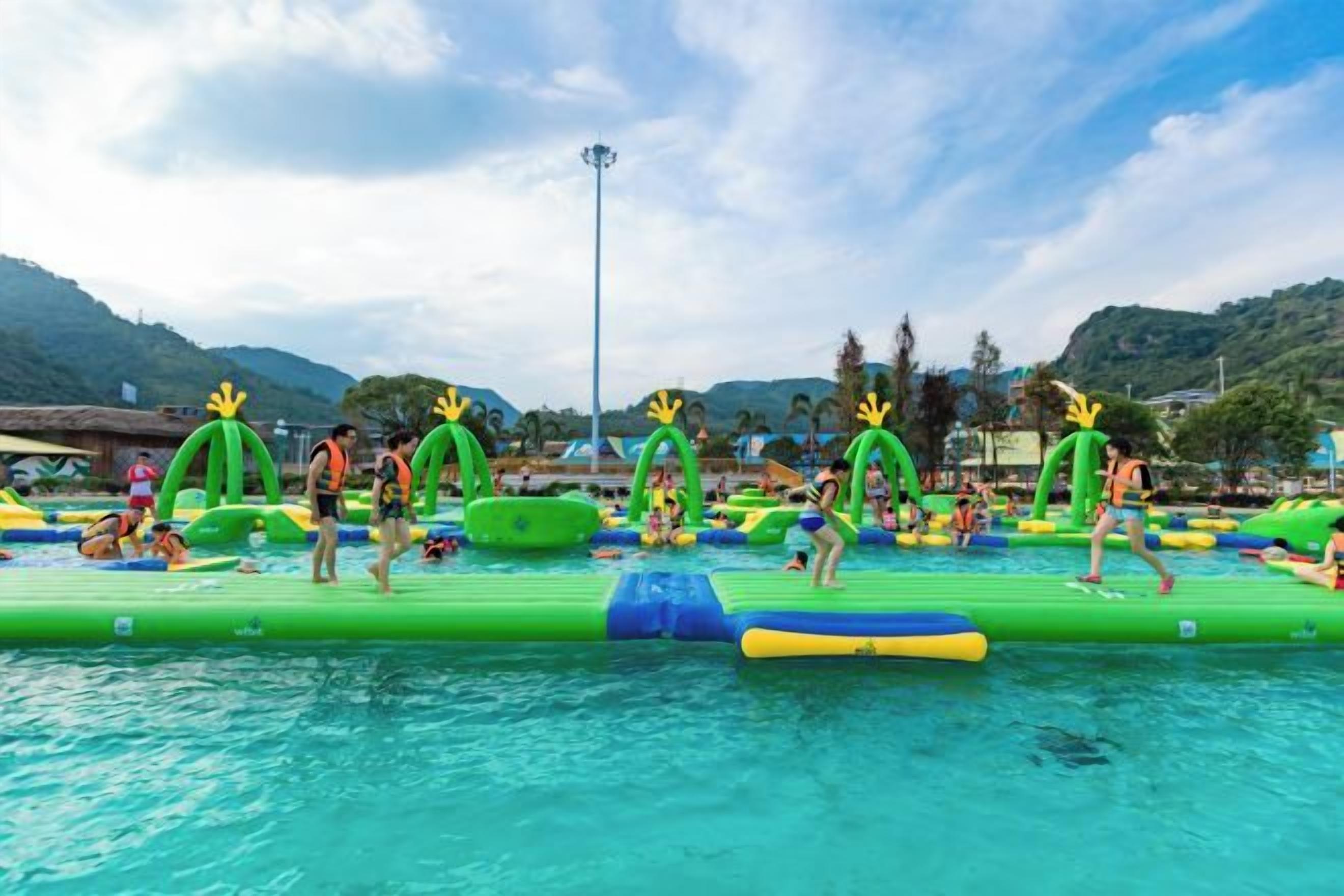 An inflatable water park with multiple slides and inflatable structures.