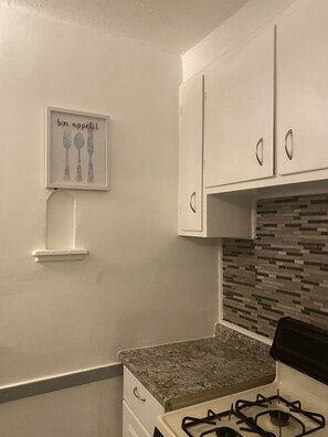 Fridge, microwave, cookware/dishes/utensils, dining tables